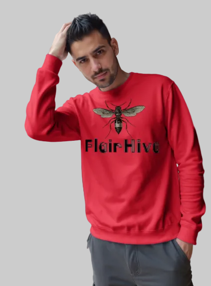 Man wearing a red sweatshirt with a logo and text, standing in front of an architectural structure.