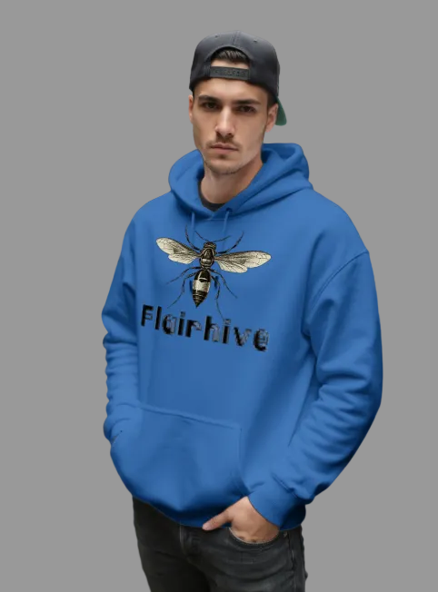 Man wearing a blue hoodie with a bee design and 'Flairhive' text on a city street.