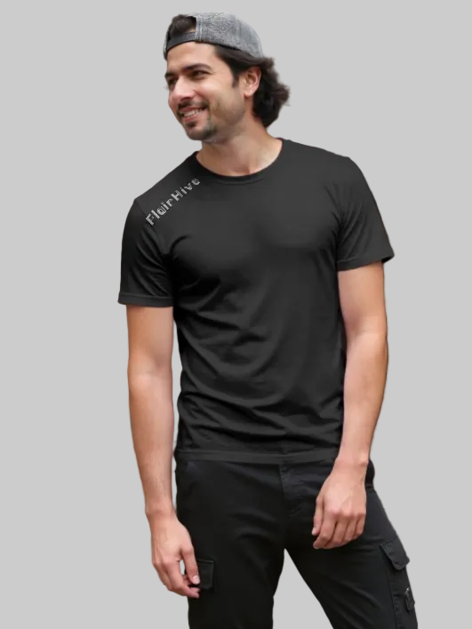 Man wearing a black t-shirt with 'FlairHive' logo outdoors.