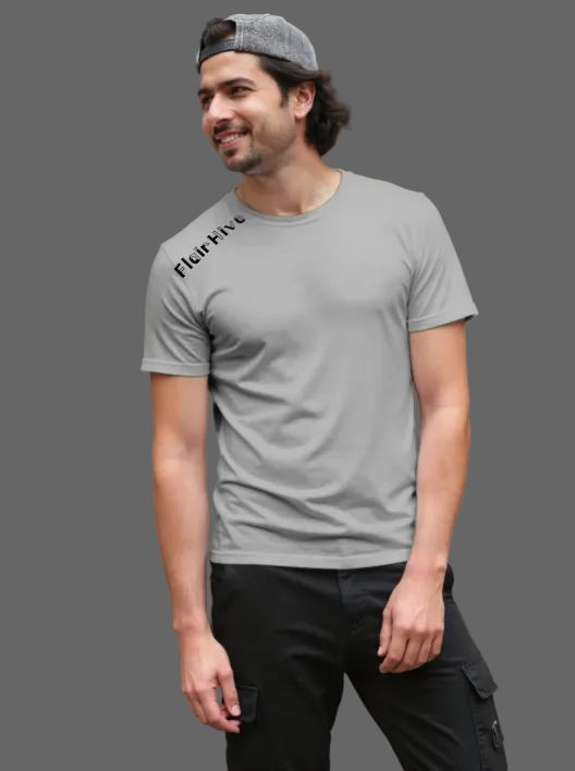 Man wearing a gray t-shirt with FlairHive printed on it, standing outdoors.