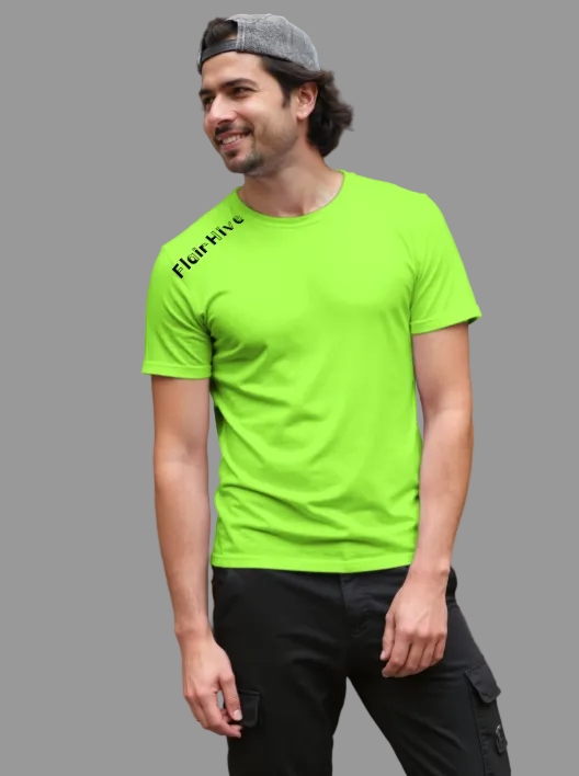 Man wearing a bright green t-shirt with 'Flairhive' branding, standing outdoors.