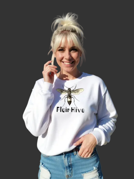 Person wearing a white sweatshirt with a bee design and 'FlourHive' text, standing outdoors.